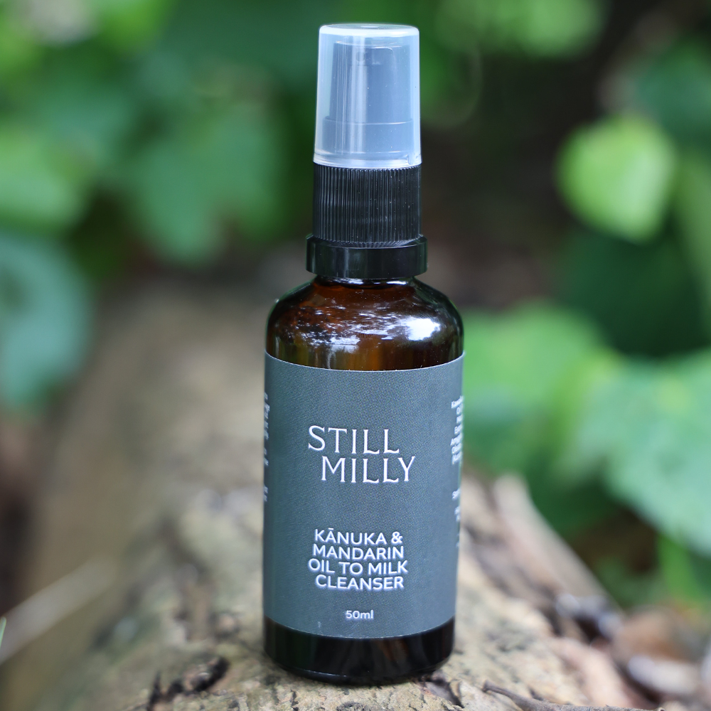 Kānuka and Mandarin oil to milk cleanser in amber glass bottle by Still Milly.